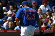 CHICAGO - AUGUST 30: Starting pitcher Carlos Zambrano #38 of the Chicago Cubs walks to the dugout after beiong removed from a game against the New York Mets in the 4th inning on August 30, 2009 at Wrigley Field in Chicago, Illinois. The Mets defeated the Cubs 4-1. (Photo by Jonathan Daniel/Getty Images)