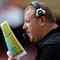 KANSAS CITY, MO - SEPTEMBER 20:  Head coach Tom Cable of the Oakland Raiders calls plays from the bench during the game against the Kansas City Chiefs at Arrowhead Stadium on September 20, 2009 in Kansas City, Missouri.  (Photo by Jamie Squire/Getty Images)