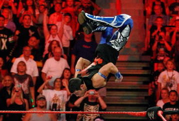 LAS VEGAS - AUGUST 24:  Wrestler Evan Bourne jumps off the ropes at wrestler Chavo Guerrero (C) as wrestler Hornswoggle lies in the foreground during the WWE Monday Night Raw show at the Thomas & Mack Center August 24, 2009 in Las Vegas, Nevada.  (Photo by Ethan Miller/Getty Images)