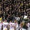 EUGENE, OR - OCTOBER 31: Oregon Duck fans stand up and cheer as the USC Trojans huddle in the third quarter of the game at Autzen Stadium on October 31, 2009 in Eugene, Oregon. The Ducks upset the Trojans 47-20. (Photo by Steve Dykes/Getty Images)