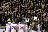 EUGENE, OR - OCTOBER 31: Oregon Duck fans stand up and cheer as the USC Trojans huddle in the third quarter of the game at Autzen Stadium on October 31, 2009 in Eugene, Oregon. The Ducks upset the Trojans 47-20. (Photo by Steve Dykes/Getty Images)