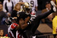 NEW ORLEANS - NOVEMBER 2:  Marques Colston #12 of the New Orleans Saints catches a pass for a touchdown against Tye Hill #24 of the Atlanta Falcons during the second quarter of the game at the Louisiana Superdome on November 2, 2009 in New Orleans, Louisiana. (Photo by Chris Graythen/Getty Images)