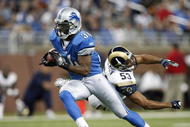 DETROIT , MI - NOVEMBER 01: Kevin Smith #34 of the Detroit Lions gets around Paris Lenon #53 of the St. Louis Rams on November 1, 2009 at Ford Field in Detroit, Michigan.  (Photo by Gregory Shamus/Getty Images)