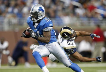 DETROIT , MI - NOVEMBER 01: Kevin Smith #34 of the Detroit Lions gets around Paris Lenon #53 of the St. Louis Rams on November 1, 2009 at Ford Field in Detroit, Michigan.  (Photo by Gregory Shamus/Getty Images)