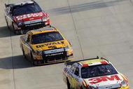 DOVER, DE - SEPTEMBER 21:  Greg Biffle, driver of the #16 3M Ford leads Matt Kenseth, driver of the #17 DeWalt Ford and Carl Edwards, driver of the #99 Office Depot Ford during Biffle's win in the NASCAR Sprint Cup Series Camping World RV 400 at Dover International Speedway on September 21, 2008 in Dover, Delaware.  (Photo by Jeff Zelevansky/Getty Images for NASCAR)