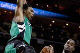 CHARLOTTE, NC - MARCH 16:  Chris Bosh #4 of the Toronto Raptors reacts after a dunk against Emeka Okafor #50 of the Charlotte Bobcats during their game at Time Warner Cable Arena on March 16, 2009 in Charlotte, North Carolina.  NOTE TO USER: User expressly acknowledges and agrees that, by downloading and/or using this Photograph, user is consenting to the terms and conditions of the Getty Images License Agreement.  (Photo by Streeter Lecka/Getty Images)