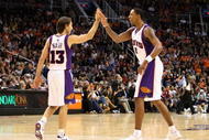 PHOENIX - OCTOBER 30:  Steve Nash #13 and Channing Frye #8 of the Phoenix Suns high five after scoring against the Golden State Warriors during the NBA game at US Airways Center on October 30, 2009 in Phoenix, Arizona. The Suns defeated the Warriors 123-101.  NOTE TO USER: User expressly acknowledges and agrees that, by downloading and or using this photograph, User is consenting to the terms and conditions of the Getty Images License Agreement.  (Photo by Christian Petersen/Getty Images)