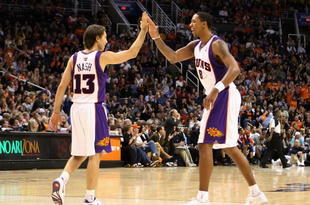 PHOENIX - OCTOBER 30:  Steve Nash #13 and Channing Frye #8 of the Phoenix Suns high five after scoring against the Golden State Warriors during the NBA game at US Airways Center on October 30, 2009 in Phoenix, Arizona. The Suns defeated the Warriors 123-101.  NOTE TO USER: User expressly acknowledges and agrees that, by downloading and or using this photograph, User is consenting to the terms and conditions of the Getty Images License Agreement.  (Photo by Christian Petersen/Getty Images)