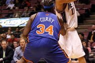 EAST RUTHERFORD, NJ - OCTOBER 20: Eddie Curry #34 of the New York Knicks defends Brook Lopez #11 of the New Jersey Nets during the second half of a pre-season game on October 20, 2008 at the IZOD Center in East Rutherford, New Jersey. The Knicks won 114-106. NOTE TO USER: User expressly acknowledges and agrees that, by downloading and/or using this Photograph, user is consenting to the terms and conditions of the Getty Images License Agreement. (Photo by Jarrett Baker/Getty Images)