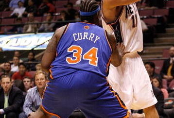 EAST RUTHERFORD, NJ - OCTOBER 20:  Eddie Curry #34 of the New York Knicks defends Brook Lopez #11 of the New Jersey Nets during the second half of a pre-season game on October 20, 2008 at the IZOD Center in East Rutherford, New Jersey. The Knicks won 114-106.  NOTE TO USER: User expressly acknowledges and agrees that, by downloading and/or using this Photograph, user is consenting to the terms and conditions of the Getty Images License Agreement.  (Photo by Jarrett Baker/Getty Images)