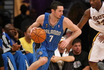 LOS ANGELES - JUNE 7:  J.J. Redick #7 of the Orlando Magic drives against Kobe Bryant #24 of the Los Angeles Lakers in Game Two of the 2009 NBA Finals at Staples Center on June 7, 2009 in Los Angeles, California.  The Lakers won 101-96 in overtime.  NOTE TO USER: User expressly acknowledges and agrees that, by downloading and or using this photograph, User is consenting to the terms and conditions of the Getty Images License Agreement.  (Photo by Stephen Dunn/Getty Images) 