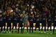 WOLVERHAMPTON, ENGLAND - NOVEMBER 07: The Arsenal players observe a minutes silence for Rememberance Sunday prior to the Barclays Premier League match between Wolverhampton Wanderers and Arsenal at Molineux on November 7, 2009 in Wolverhampton, England. (Photo by Richard Heathcote/Getty Images)