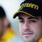 ABU DHABI, UNITED ARAB EMIRATES - OCTOBER 30:  Fernando Alonso of Spain and Renault lines up for a team photo before practice for the Abu Dhabi Formula One Grand Prix at the Yas Marina Circuit on October 30, 2009 in Abu Dhabi, United Arab Emirates.  (Photo by Clive Mason/Getty Images)