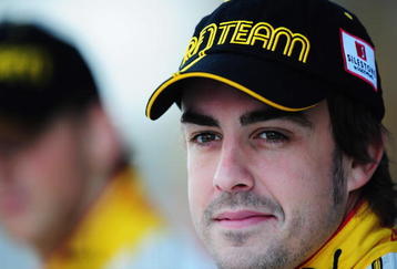 ABU DHABI, UNITED ARAB EMIRATES - OCTOBER 30:  Fernando Alonso of Spain and Renault lines up for a team photo before practice for the Abu Dhabi Formula One Grand Prix at the Yas Marina Circuit on October 30, 2009 in Abu Dhabi, United Arab Emirates.  (Photo by Clive Mason/Getty Images)