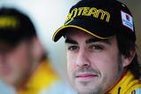 ABU DHABI, UNITED ARAB EMIRATES - OCTOBER 30:  Fernando Alonso of Spain and Renault lines up for a team photo before practice for the Abu Dhabi Formula One Grand Prix at the Yas Marina Circuit on October 30, 2009 in Abu Dhabi, United Arab Emirates.  (Photo by Clive Mason/Getty Images)