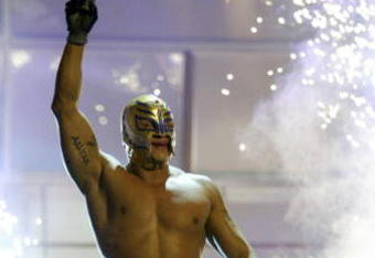 LAS VEGAS - DECEMBER 2:  (U.S. TABLOIDS OUT)   WWE wrestler Rey Mysterio walks on stage during the '1st Annual Video Game Awards' at the MGM Grand Garden Arena December 2, 2003 in Las Vegas, Nevada.  The show premieres on Spike T.V. Thursday, December 4 at 9:00PM ET/PT.  (Photo by Frank Micelotta/Getty Images)