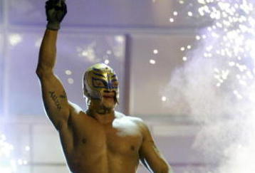 LAS VEGAS - DECEMBER 2:  (U.S. TABLOIDS OUT)   WWE wrestler Rey Mysterio walks on stage during the '1st Annual Video Game Awards' at the MGM Grand Garden Arena December 2, 2003 in Las Vegas, Nevada.  The show premieres on Spike T.V. Thursday, December 4 at 9:00PM ET/PT.  (Photo by Frank Micelotta/Getty Images)