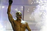 LAS VEGAS - DECEMBER 2:  (U.S. TABLOIDS OUT)   WWE wrestler Rey Mysterio walks on stage during the '1st Annual Video Game Awards' at the MGM Grand Garden Arena December 2, 2003 in Las Vegas, Nevada.  The show premieres on Spike T.V. Thursday, December 4 at 9:00PM ET/PT.  (Photo by Frank Micelotta/Getty Images)
