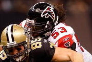 NEW ORLEANS - NOVEMBER 02:  David Thomas #85 of the New Orleans Saints runs for a first down against Erik Coleman #26 and Mike Peterson #53 of the Atlanta Falcons during the first quarter of the game at the Louisiana Superdome on November 2, 2009 in New Orleans, Louisiana.  (Photo by Chris Graythen/Getty Images)