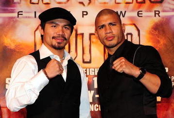 BEVERLY HILLS, CA - SEPTEMBER 14:  Manny Pacquiao and  Miguel Cotto pose for pictures during the press conference at the Beverly Hills Hotel on September 14, 2009 in Beverly Hills, California.  (Photo by Jacob De Golish/Jacob De Golish)