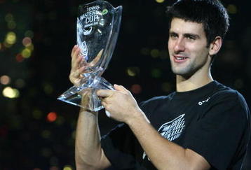 SHANGHAI, CHINA - NOVEMBER 16: (CHINA OUT) Novak Djokovic of Serbia holds up the winner's trophy following his victory over Nikolay Davydenko of Russia at the men's singles final match in the Tennis Masters Cup held at Qi Zhong Stadium on November 16, 2008 in Shanghai, China. Djokovic won 6-1, 7-5 to take the title. (Photo by China Photos/Getty Images)