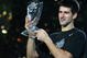 SHANGHAI, CHINA - NOVEMBER 16: (CHINA OUT) Novak Djokovic of Serbia holds up the winner's trophy following his victory over Nikolay Davydenko of Russia at the men's singles final match in the Tennis Masters Cup held at Qi Zhong Stadium on November 16, 2008 in Shanghai, China. Djokovic won 6-1, 7-5 to take the title. (Photo by China Photos/Getty Images)