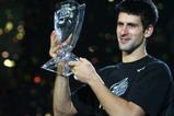 SHANGHAI, CHINA - NOVEMBER 16: (CHINA OUT) Novak Djokovic of Serbia holds up the winner's trophy following his victory over Nikolay Davydenko of Russia at the men's singles final match in the Tennis Masters Cup held at Qi Zhong Stadium on November 16, 2008 in Shanghai, China. Djokovic won 6-1, 7-5 to take the title. (Photo by China Photos/Getty Images)