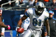 CHICAGO - OCTOBER 04: Calvin Johnson #81 of the Detroit Lions breaks away from Kevin Payne #44 of the Chicago Bears on October 4, 2009 at Soldier Field in Chicago, Illinois. The Bears defeated the Lions 48-24. (Photo by Jonathan Daniel/Getty Images)