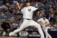 NEW YORK - JUNE 17: Chien-Ming Wang #40 of the New York Yankees pitches against the Washington Nationals on June 17, 2009 at Yankee Stadium in the Bronx borough of New York City. (Photo by Jim McIsaac/Getty Images)