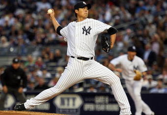 NEW YORK - JUNE 17:  Chien-Ming Wang #40 of the New York Yankees pitches against the Washington Nationals on June 17, 2009 at Yankee Stadium in the Bronx borough of New York City.  (Photo by Jim McIsaac/Getty Images)