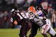 STARKVILLE, MS - OCTOBER 24:  Quarterback Tyson Lee # 16 of the Mississippi State Bulldogs is tackled by defensive end Carlos Dunlap # 8 of the Florida Gators, at Davis Wade Stadium on  October 24, 2009 in Starkville, Mississippi  (Photo by Rick Dole/Getty Images)