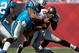 TAMPA, FL - OCTOBER 18:  Defensive end Julius Peppers #90 of the Carolina Panthers tackles quarterback Josh Johnson #11 of the Tampa Bay Buccaneers during the game at Raymond James Stadium on October 18, 2009 in Tampa, Florida.  (Photo by J. Meric/Getty Images)