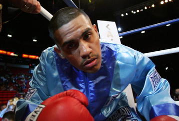 LAS VEGAS - APRIL 08:  Juan Diaz stares into the camera as he enters the ring before his fight against Jose Miguel Cotto during the WBA Lightweight Championship fight at Thomas & Mack Arena on April 8, 2006 in Las Vegas, Nevada. Diaz defeated Cotto by decision to remain champion.  (Photo by Al Bello/Getty Images)