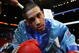 LAS VEGAS - APRIL 08: Juan Diaz stares into the camera as he enters the ring before his fight against Jose Miguel Cotto during the WBA Lightweight Championship fight at Thomas & Mack Arena on April 8, 2006 in Las Vegas, Nevada. Diaz defeated Cotto by decision to remain champion. (Photo by Al Bello/Getty Images)