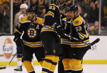 BOSTON - NOVEMBER 07:  Mark Recchi #28 of the Boston Bruins is congratulated by teammates Zdeno Chara #33, Patrice Bergeron #37 and Derek Morris #53 in the first period against the Buffalo Sabres on November 7, 2009 at the TD Garden in Boston, Massachusetts.  (Photo by Elsa/Getty Images)