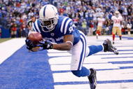 INDIANAPOLIS - NOVEMBER 01: Reggie Wayne #87 of the Indianapolis Colts catches a touchdown pass during the NFL game against the San Francisco 49ers at Lucas Oil Stadium on November 1, 2009 in Indianapolis, Indiana.  (Photo by Andy Lyons/Getty Images)
