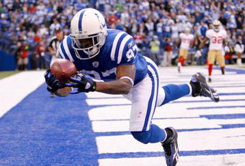 INDIANAPOLIS - NOVEMBER 01: Reggie Wayne #87 of the Indianapolis Colts catches a touchdown pass during the NFL game against the San Francisco 49ers at Lucas Oil Stadium on November 1, 2009 in Indianapolis, Indiana.  (Photo by Andy Lyons/Getty Images)