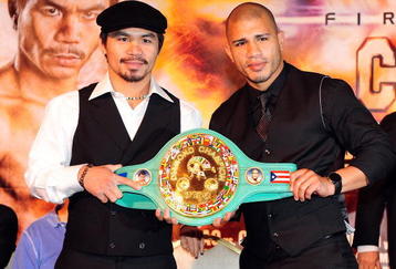 BEVERLY HILLS, CA - SEPTEMBER 14:  Manny Pacquiao and  Miguel Cotto pose for pictures during the press conference at the Beverly Hills Hotel on September 14, 2009 in Beverly Hills, California.  (Photo by Jacob de Golish/Getty Images)