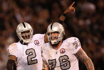 OAKLAND, CA - SEPTEMBER 14:  (L-R) JaMarcus Russell #2 and Robert Gallery #76 of the Oakland Raiders celebrate after Russell threw a 57-yard touchdown pass to Louis Murphy #18 in the fourth quarter against the San Diego Chargers on September 14, 2009 at the Oakland-Alameda County Coliseum in Oakland, California.  (Photo by Ezra Shaw/Getty Images)
