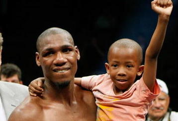 LAS VEGAS - APRIL 11:  Paul Williams holds his son Paul Williams Jr. as he celebrates defeating Winky Wright in a unanimous decision in their middleweight bout at the Mandalay Bay Events Center April 11, 2009 in Las Vegas, Nevada.  (Photo by Ethan Miller/Getty Images)