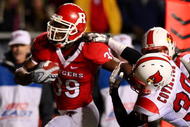 PISCATAWAY, NJ - DECEMBER 04: Jourdan Brooks #39 of the Rutgers Scarlet Knights runs a fourth quarter touchdown against Daniel Covington #30 of the Louisville Cardinals at Rutgers Stadium on December 4, 2008 in Piscataway, New Jersey. (Photo by Jim McIsaac/Getty Images)