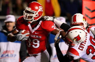 PISCATAWAY, NJ - DECEMBER 04: Jourdan Brooks #39 of the Rutgers Scarlet Knights runs a fourth quarter touchdown against Daniel Covington #30 of the Louisville Cardinals at Rutgers Stadium on December 4, 2008 in Piscataway, New Jersey. (Photo by Jim McIsaac/Getty Images)