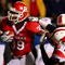 PISCATAWAY, NJ - DECEMBER 04:  Jourdan Brooks #39 of the Rutgers Scarlet Knights runs a fourth quarter touchdown against Daniel Covington #30 of the Louisville Cardinals at Rutgers Stadium on December 4, 2008 in Piscataway, New Jersey.  (Photo by Jim McIsaac/Getty Images)
