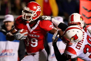 PISCATAWAY, NJ - DECEMBER 04:  Jourdan Brooks #39 of the Rutgers Scarlet Knights runs a fourth quarter touchdown against Daniel Covington #30 of the Louisville Cardinals at Rutgers Stadium on December 4, 2008 in Piscataway, New Jersey.  (Photo by Jim McIsaac/Getty Images)