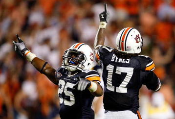 AUBURN, AL - SEPTEMBER 19:  Daren Bates #25 and Josh Bynes #17 of the Auburn Tigers celebrate Bynes interception in the final minutes of their 41-30 win over the West Virginia Mountaineers at Jordan-Hare Stadium on September 19, 2009 in Auburn, Alabama.  (Photo by Kevin C. Cox/Getty Images)