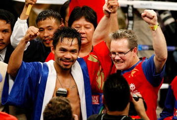 LAS VEGAS - DECEMBER 06:  (L-R) Manny Pacquiao of the Philippines celebrates with his trainer Freddie Roach after defeating Oscar De La Hoya in their welterweight fight at the MGM Grand Garden Arena December 6, 2008 in Las Vegas, Nevada.  (Photo by Ethan Miller/Getty Images)
