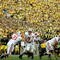 ANN ARBOR, MI - SEPTEMBER 23:  John Stocco #7 of the Wisconsin Badgers hands off to Dywon Rowan #21 against the Michigan Wolverines on September 23, 2006 at Michigan Stadium in Ann Arbor, Michigan. Michigan defeated Wisconsin 27-13.  (Photo by Jonathan Daniel/Getty Images)