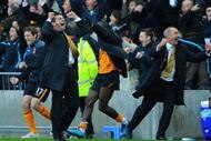 HULL, ENGLAND - NOVEMBER 08: Hull City manager Phil Brown celebrates his teams late winning goal during the Barclays Premier League match between Hull City and Stoke City at the KC Stadium on November 8, 2009 in Hull, England.  (Photo by Michael Regan/Getty Images)