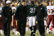 LANDOVER, MD - OCTOBER 26: Brian Westbrook #36 of the Philadelphia Eagles is escorted off the field after getting hit during the first quarter of the game against the Washington Redskins at FedEx Field October 26, 2009 in Landover, Maryland. (Photo by Win McNamee/Getty Images)