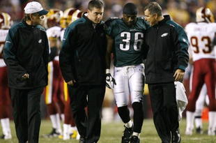 LANDOVER, MD - OCTOBER 26:  Brian Westbrook #36 of the Philadelphia Eagles is escorted off the field after getting hit during the first quarter of the game against the Washington Redskins at FedEx Field October 26, 2009 in Landover, Maryland. (Photo by Win McNamee/Getty Images)